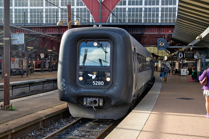 5280, 17.24 sterport-Nykbing Falster-Hamburg, Copenhagen Central station 
 A DSB IC3 set 5280 'Henrik Gerner' leaves Copenhagen Central with the 17.25 17.24 sterport to Hamburg via Nykbing Falster and the Rdby (Denmark) and Puttgarden (Germany) car\rail ferry. In the coming few years the combined car/rail ferries will cease operation as the first stage towards the complete removal of the ferry link due to the opening of the Fehmarn Belt fixed link, an ambitious and very costly eleven-mile immersed tunnel due for completion in 2028. 
 Keywords: 5280 17.24 sterport-Nykbing Falster-Hamburg Copenhagen Central station Henrik Gerner DSB IC3