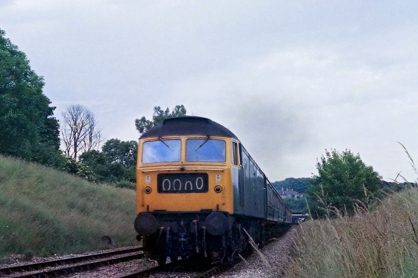 47352, unidentified Weymouth-Bristol Temple Meads working, Bradford-on-Avon foot crossing ST820605 
 47352 accelerates away from its stop at Bradford-on-Avon with a Weymouth to Bristol Temple Meads working. Whilst 31s formed the mainstay of loco. hauled workings on the Avon Valley route, 47s were also regular performers. Notice that the 47 is carrying OOOO in its redundant headcode panel that would soon be replaced by twin domino dots on a black background and then ultimately plated over with twin marker lights installed. 47352 ended its working career in 1998 being cut up at Raxstar's Frodingham (Scunthorpe) facility during May 2000.