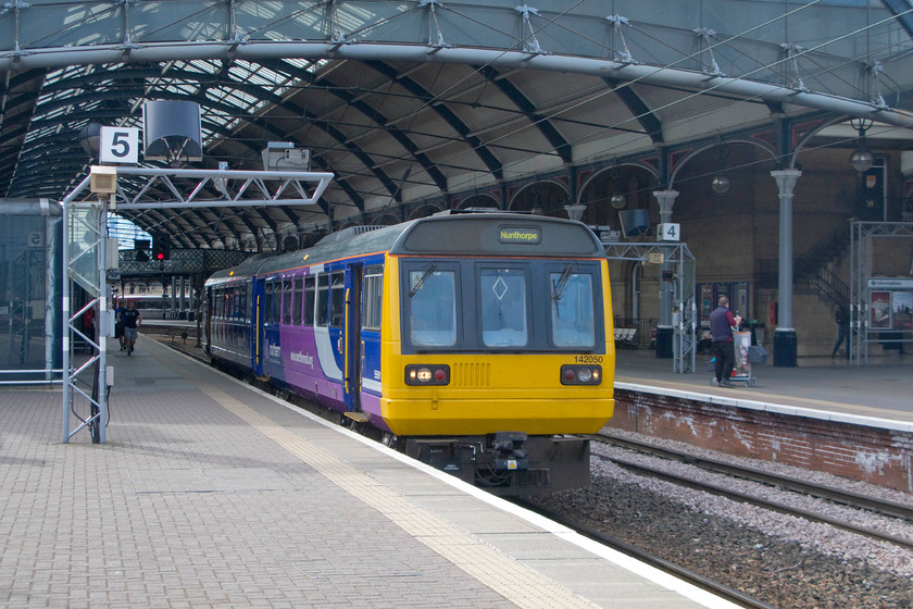 142050, NT 14.45 Hexham-Nunthorpe (2N34), Newcastle station 
 The northeast has its fair share of Pacers with these un-loved units providing the backbone to the services throughout the region, all operated by Northern Trains. 142050 waits at platform five of Newcastle Central working the 2N34 Hexham to Nunthorpe service. 
 Keywords: 142050 14.45 Hexham-Nunthorpe 2N34 Newcastle station Northern Trains Pacer