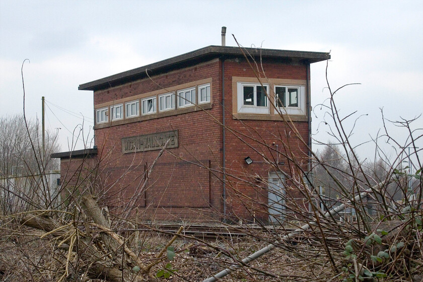 Wigan Wallgate signal box (LMS, 1941) 
 Andy pointed out this signal box to me as we were departing from Wigan Northwestern station earlier in the day on our northbound Pendolino. Unbelievably, I have never seen it before despite passing it on the elevated and adjacent WCML many times! We vowed on our return to seek it out and after several abortive blind alleys, we managed this vantage point from an industrial estate in Wigan. Wigan Wallgate is a London Midland & Scottish Railway Company non-standard ARP design that opened on 27th July 1941. It contained a Siemens-General Electric EB132 individual function switch signalling panel and in one fell swoop saw the closure of no less than four boxes in the Wigan area. However, I have a question about the installation of this panel. 1941 was the third year of World War II and Siemens was a German company. So, how did one of their panels find its way into the box; advice anybody? 
 Keywords: Wigan Wallgate signal box LMS