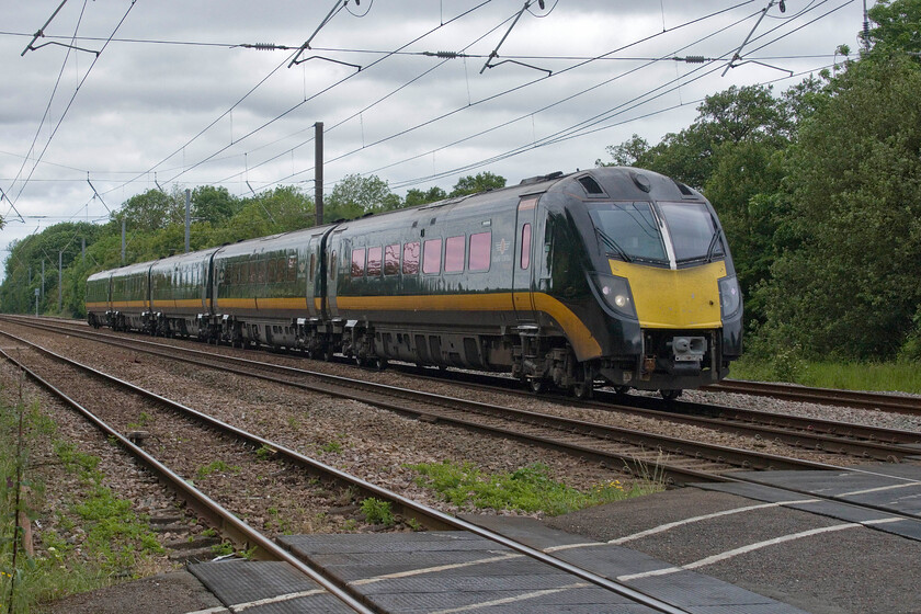 180107, GC 08.53 Sunderland-London King's Cross (1A61, RT), Lolham level crossing 
 Now over twenty years old the Class 180 Adelantes have been the ultimate in railway hot potatoes passing between various operators over the years with their various problems and issues creating headaches for train planners and maintenance teams alike. With the first two sets now stood down and stored they are probably in their final few years of operation with Grand Central now being the only TOC operating the units. 180107 passes Lolham level crossing working the 1A61 08.53 Sunderland to King's Cross service. 
 Keywords: 180107 08.53 Sunderland-London King's Cross 1A61 Lolham level crossing Grand central Adelantes