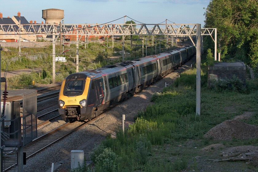 221104 & 221103, VT 19.10 London Euston-Holyhead (1D93, 10L), site of Roade station 
 This time next year images such as this should be confined to history! The ageing and tiresome Voyagers should have been withdrawn from operations on the WCML next year with the introduction of Class 805 bi-mode units as part of 350 million contract with Hitachi. In the meantime, consecutively numbered 221104 and 221103 work the 1D93 19.10 Euston to Holyhead service past Roade in some lovely evening sunshine. 
 Keywords: 221104 221103 19.10 London Euston-Holyhead 1D93 site of Roade station Avanti West Coast Voyager