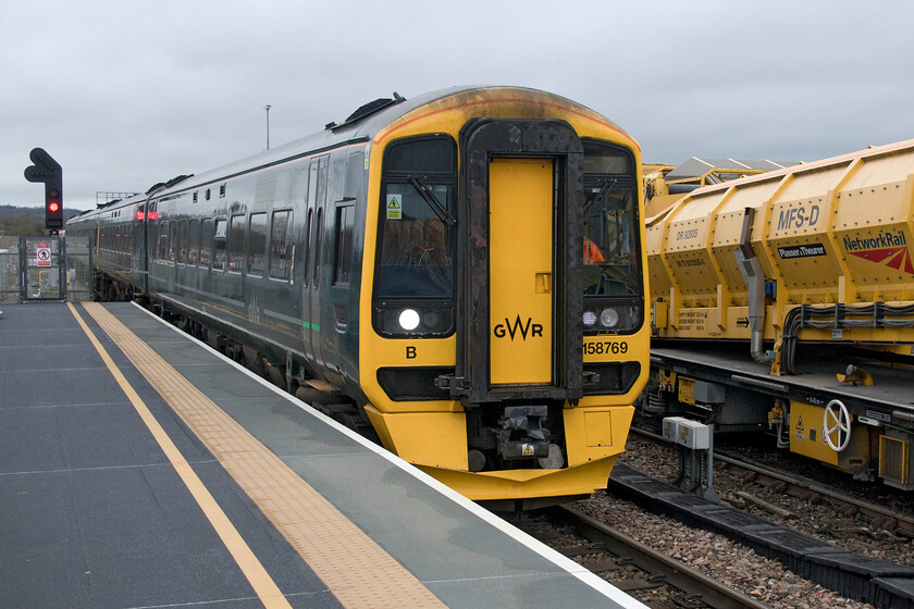 158769 & 158745, GW 10.23 Portsmouth Harbour-Cardiff Central (1F14, 4L), Westbury station 
 158769 paired with 158745 arrives at Westbury station working the 1F14 10.23 Portsmouth Harbour to Cardiff Central GWR service. Over the years I have witnessed many different types of traction working these inter-regional services between the South Coast and South Wales ranging from Hymeks, Class 204 DEMUs, Class 31s and Class 33s. 
 Keywords: 158769 158745 10.23 Portsmouth Harbour-Cardiff Central 1F14 Westbury station GWR Great Western Railway