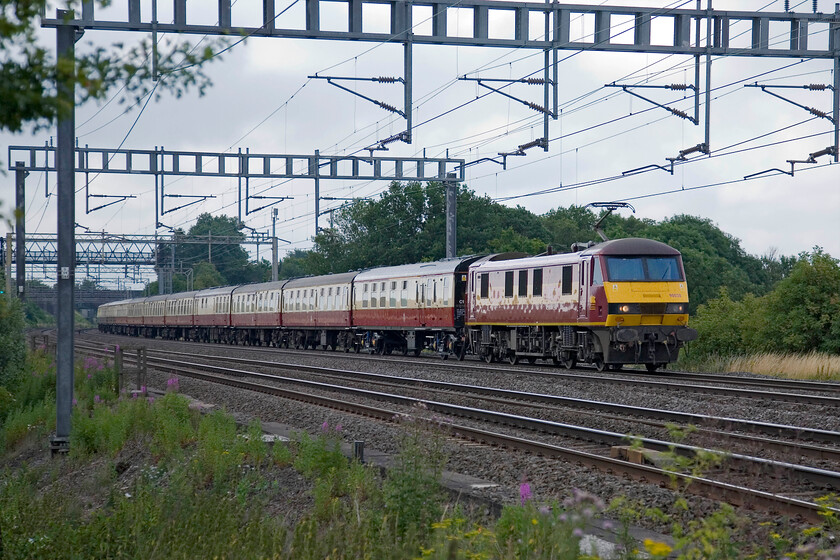 90028, outward leg of The Cardigan Bay Panorama, 07.10 London Euston-Aberystwyth (1Z96), between Roade & Ashton 
 With its EWS paint almost matching the stock, 90028 leads the outward leg of The Cardigan Bay Panorama that left Euston at 07.10 heading for Aberystwyth. The Class 90 was removed at Bescot with two of Network Rail's Cambrian Line ERTMS Project Class 37s taking over. A slight delay occurred later in the outward journey with the double-headed 37s having to run round at Shrewsbury (they were planned to take the avoider line at Sutton Bridge Junction) due to an ERTMS fault on the leading locomotive 97304 'John Tiley'. 
 Keywords: 90028 The Cardigan Bay Panorama 07.10 London Euston-Aberystwyth 1Z96 between Roade & Ashton UK Railtours