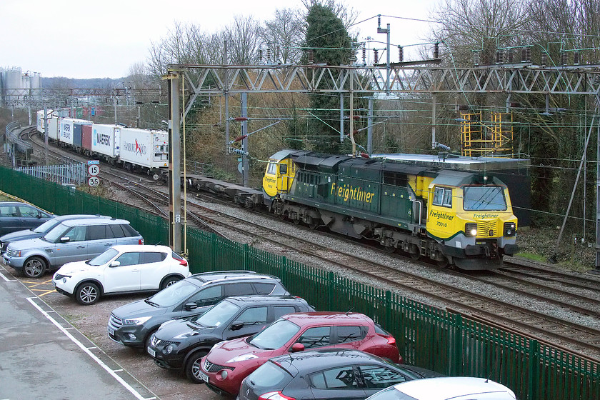 70010, 09.25 Southampton-Crewe Basford Hall (4M28), Westbridge, Northampton 
 As we were travelling back from London, we overtook this freight working at Milton Keynes. As I had to walk and collect the car I figured, quite correctly as it turned out, that it would be only a short time behind our train. As I was crossing Westbridge in Northampton just south of the station, it appeared around the corner; sometimes it's great when things just come together! 70010 leads the 4M28 09.25 Southampton to Ditton Freightliner that, unusually today was terminating at Crewe Basford Hall 
 Keywords: 70010 09.25 Southampton-Crewe Basford Hall 4M28 Westbridge, Northampton