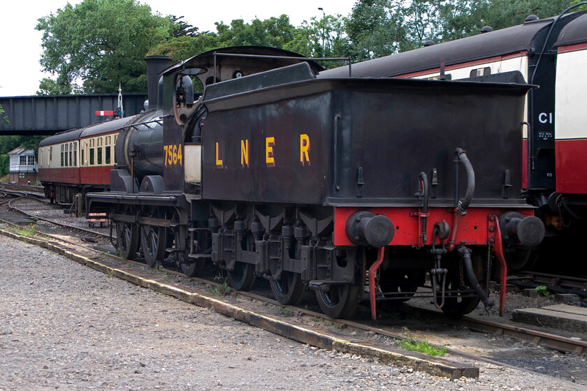 7564, awaiting removal, Sheringham station yard 
 7564 was built at Stratford Works in 1912. It remained an East Anglian locomotive throughout its life, largely operating in Norfolk and Suffolk, until withdrawal came in September 1962 ironically from Stratford where it was born fifty years earlier. It was one of the first locomotives to be bought by the M&GN Society to be used for hauling trains on the North Norfolk Railway. This it has done ever since along with many forrays to other heritage lines being particularly in demand during the 2012 season last year to mark its centenary. Alas, it was withdrawn from operational use two months ago as its boiler certificate has expired once again so it now awaits developments; more of this later! 
 Keywords: 7564 awaiting removal Sheringham station yard