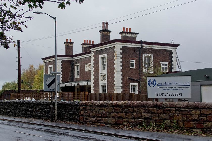 Mostyn station (Closed) 
 In 1981 I surveyed the North Wales coastal route on my summer trip with Graham and took a photograph of the closed Mostyn station building. Back then, the station building was empty and derelict in stark contrast to how it looks in this image, see.... https://www.ontheupfast.com/p/21936chg/30035069761/mostyn-station-closed. This view shows the 1848 Chester and Holyhead building in happier times now restored and in use as a private dwelling. The station was shut by British Railways in 1966 after a steady run down in services. It once boasted four platforms and a footbridge and like many Victorian stations was vastly oversized for the community it served; in the case of Mostyn, a small village. 
 Keywords: Mostyn station