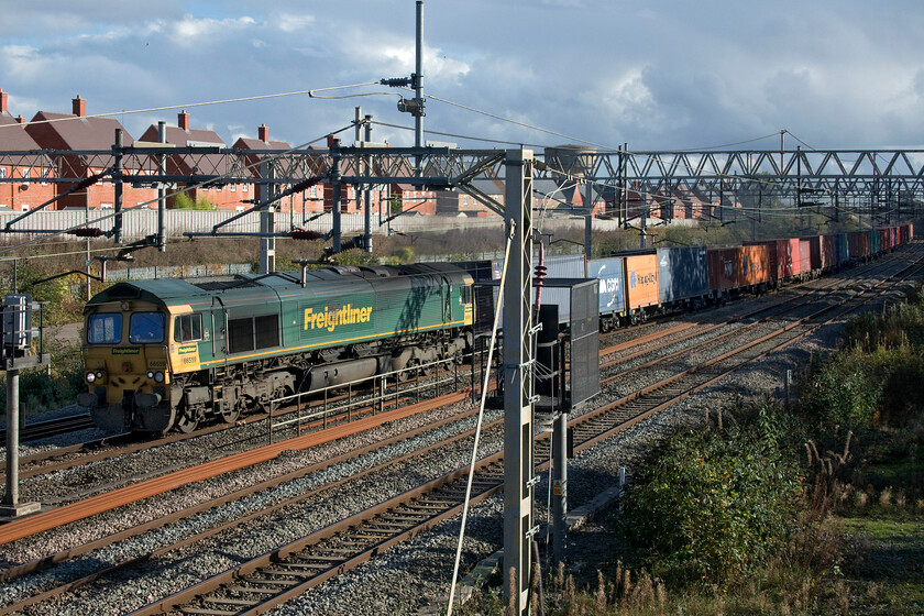 66559, 09.14 Southampton MCT-Garston (4M58, 2L), site of Roade station 
 The 09.14 Southampton to Garston Freightliner running as 4M58 passes the site of Roade station with 66559 leading. Despite the cloud, it was a pleasantly warm afternoon for the end of October and with a steady south-westerly wind it did not stay cloudy for very long! 
 Keywords: 66559 09.14 Southampton MCT-Garston 4M58 site of Roade station Freightliner