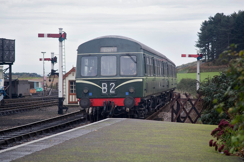 M51192 & M56352, 11.20 Sheringham-Holt, Weybourne station 
 Having done its first round-trip of the day, the operational class 101 DMU formed by M51192 and M56352 arrives at Weybourne with the 11.20 Sheringham to Holt. There is a huge amount of interest at Weybourne station both for the enthusiast and 'normal' visitor. It has a lovely atmosphere and you can sit on the platform with a drink and lap it all up and finish off using their award winning preserved toilets complete with Thomas Crapper cisterns! 
 Keywords: M51192 M56352 11.20 Sheringham-Holt Weybourne station