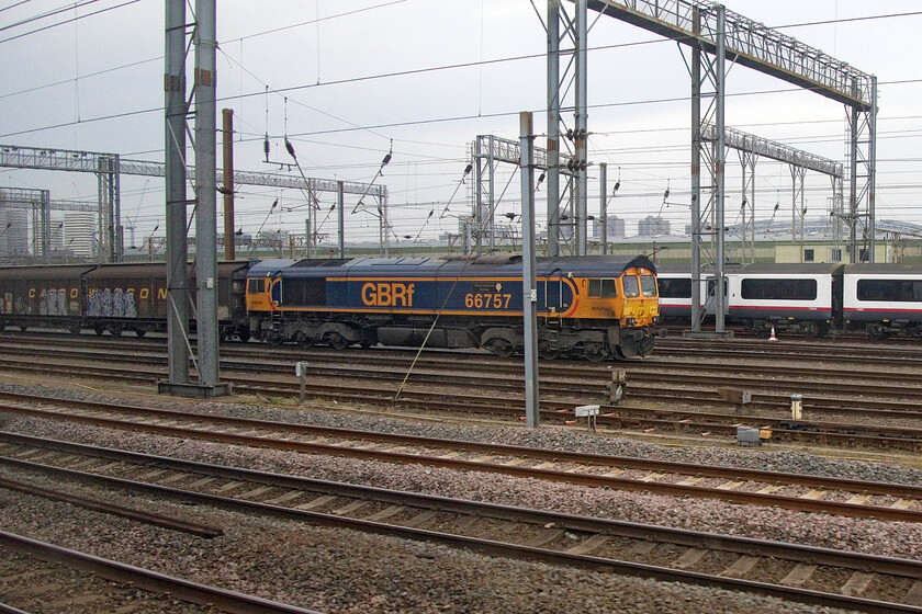 66757, 15.20 Wembley Reception-Dollands Moor (6Z65, RT), Wembley Yard 
 GBRf's 66757 'West Somerset Railway' rests in Wembley Yard before heading out in the afternoon as the 15.20 service to Dollands Moor. Notice the former Great Eastern Class 321 behind. This is one of many of these units that have been stored in Wembley Yard for many months now awaiting developments on their future. However, as time drags on, these plans are becoming less likely with the inevitable trip to the breakers looming. 
 Keywords: 66757 15.20 Wembley Reception-Dollands Moor 6Z65 Wembley Yard GBRf West Somerset Railway