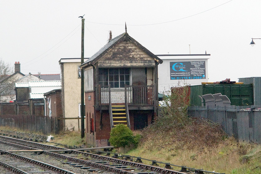 Pwllheli West Frame Signal Box (Cambrian, 1909) 
 The rather sad looking Pwllheli West Frame signal box stands unused and unloved just beyond the station. The box has been closed since 1976 being downgraded from Pwllheli West to Pwllheli West Frame. This was when BR introduced the no-signalman token system that precipitated the closure of a number of boxes on the line. The box was built by the Cambrian Railway Company to a Dutton and Company type 2 design fitted with a 40 lever frame and was opened in 1909. 
 Keywords: Pwllheli West Frame Signal Box