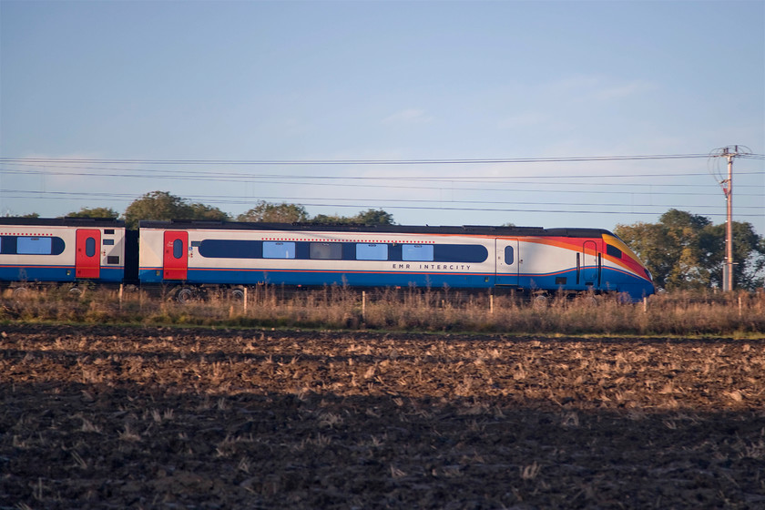 222019, EM 08.02 London St. Pancras-Sheffield (1F10, 4L), Wymington SP958633 
 222019, having surmounted Sharnbrook summit, descends down towards Wellingborough with the 08.02 St. Pancras to Sheffield. This pan shot is taken from a field boundary near the village of Wymington on a beautiful autumn morning with a real nip in the air. 
 Keywords: 222019 08.02 London St. Pancras-Sheffield 1F10 Wymington SP958633