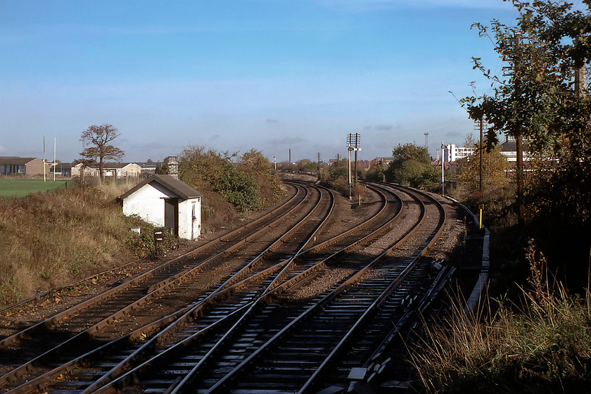 Dudding Hill Junction, from signal box steps, TQ227858 
 A photograph taken from the steps of Dudding Hill Junction signal box looking northeast. Both of the lines seen in this photograph lead to the MML forming a triangular junction with it. The line to the left leads to Brent Curve Junction with the one to right joining the MML at Cricklewood Curve Junction leading into St. Pancras. Forty years on from this photograph being taken, the lovely linesman's hut has gone but the rugby posts are still extant in the Dollis Hill sports ground to the far left. 
 Keywords: Dudding Hill Junction from signal box steps TQ227858