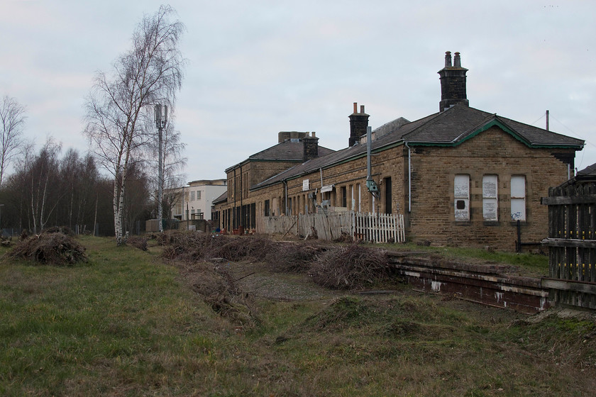 Former Woodhead platforms, Penistone station 
 When I last stood on this spot at Penistone station I was a 14 year-old school boy who was travellling on the Pennine Explorer railtour and took this picture...... https://www.ontheupfast.com/v/photos/21936chg/25481195204/x76016-76009-pennine-explorer-cardiff It is incredible to think that this station was once at a busy junction that carried through express trains between London and Manchester. In its later years it was an important and strategic freight route. It's interesting to consider that, if when it was electrified in 1955, it had been built to the 25Kv standard, rather than the more unusual 1.5Kv DC system then the line could still be in operation today. Indeed, there is continual talk of it partially re-openeing as the pressure builds on the remaining two trans-Pennine routes. 
 Keywords: Former Woodhead platforms Penistone station