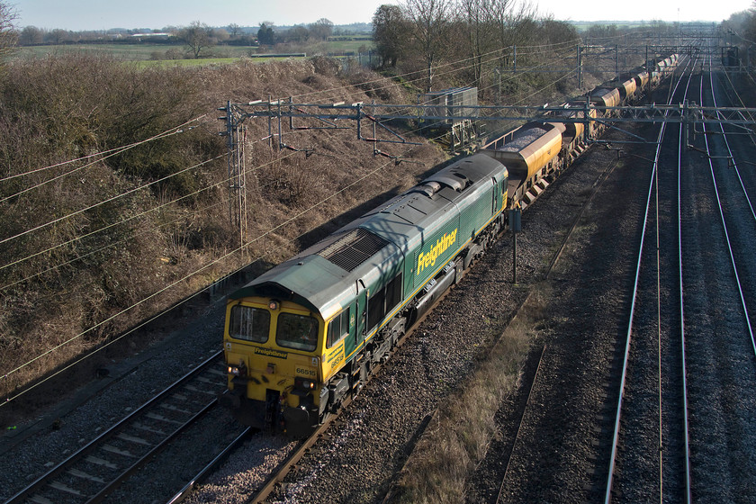 66515, 07.46 Ledburn Junction-Crewe Basford Hall (via Wembley yard) (6Y52), Victoria bridge 
 The second of the three infrastructure trains to pass Victoria bridge in 45 minutes of each other. This one is led by 66515 (a cop for me!) that had started out heading south from Ledburn Junction to Wembley. Here it ran round and then returned north as 6Y52 to Crewe Basford Hall. 
 Keywords: 66515 07.46 Ledburn Junction-Crewe Basford Hall via Wembley yard 6Y52 Victoria bridge