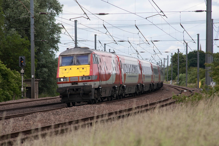 82209, GR 14.05 York-London King`s Cross, (1Y86, 6L), Offord D`Arcy TL213652 
 Leaning into one of the reverse curves at Offord D'Arcy DVT 82209 leads the 14.05 York to London King's Cross working. In between the posts on the right hand side can be seen the elegant 14th Century spire of St. Peter's church on the village of Offord D'Arcy 
 Keywords: 82209, 1Y86 Offord Darcy TL213652