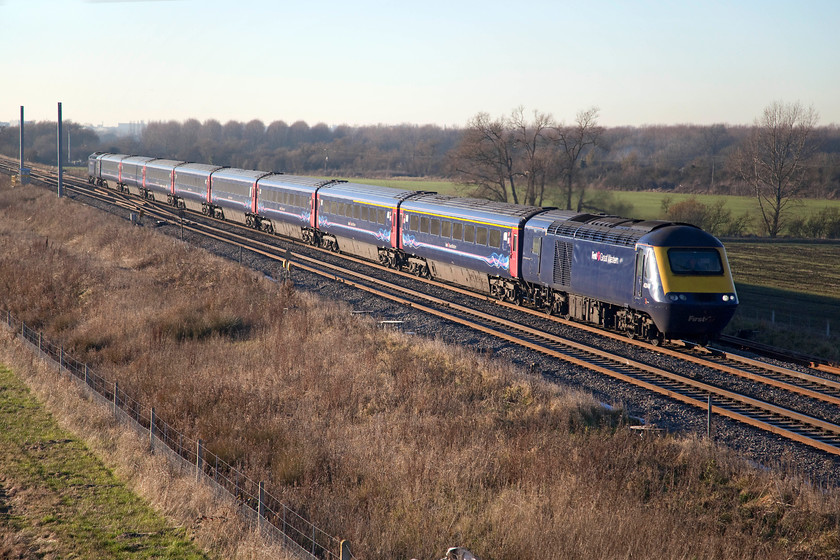 43148 & 43189, GW 12.27 Swansea-London Paddington (1L62), Bourton SU228874 
 43148 and 43189 accelerate away from Swindon near Bourton with the 12.27 Swansea to Paddington. The arrival of the electrification masts at this location has begun with them randomly placed rather than logically being inserted as the installation train heads westwards. 
 Keywords: 43148 43189 12.27 Swansea-London Paddington 1L62 Bourton SU228874