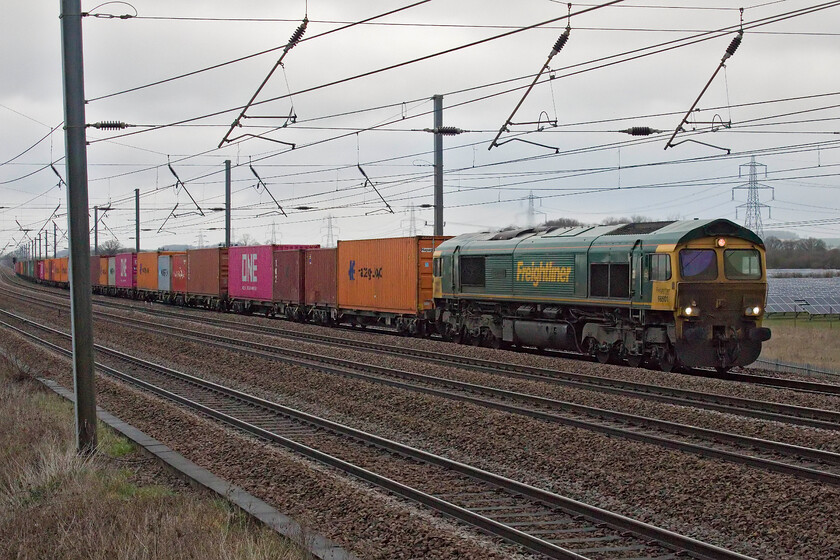 66501, 22.09 Coatbridge-Wembley Reception (4L59, 40E), Sandy TL176510 
 Just as Andy arrived at New Zealand bridge near Sandy, a train was observed approaching somewhere near Tempsford. 66501 Japan 2001 is seen leading the 4L59 overnight Freightliner that left Coatbridge at 22.09 destination Wembley Yard. This service, like all of the others observed on this quiet day on the railways, arrived early with the rest being the same or on time. 
 Keywords: 66501 22.09 Coatbridge-Wembley Reception 4L59 Sandy TL176510 Freightliner