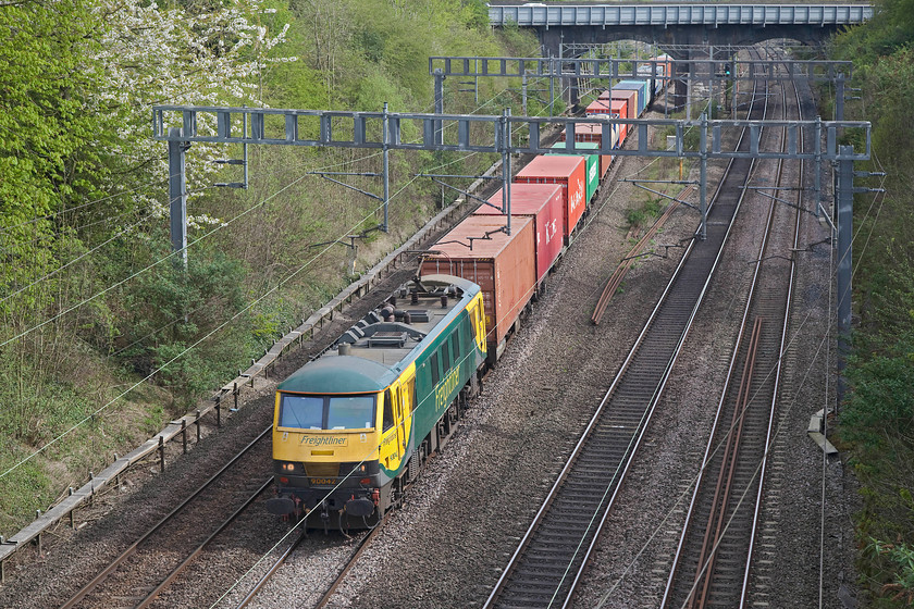 90042, 09.32 Felixstowe North-Crewe Basford Hall (4M88), Hyde Road bridge 
 Freightliner's 90042 works the well loaded 09.32 Felixstowe to Crewe Basford Hall (4M88) through Roade in Northamptonshire. Having done a spotlight search on my Mac I have discovered that 90042 is my most photographed class 90! I have photographed it regularly for a number of years in a variety of liveries and on a variety of workings. 
 Keywords: 90042 09.32 Felixstowe North-Crewe Basford Hall 4M88 Hyde Road bridge