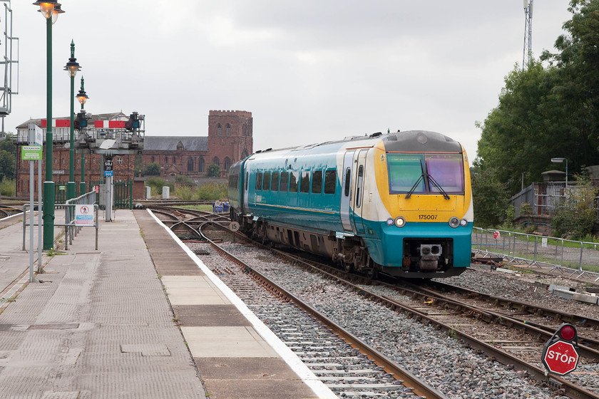 175007, AW 09.21 Cardiff Central-Holyhead (1W92), Shrewsbury station 
 175007 arrives at Shrewsbury station with the 09.21 Cardiff to Holyhead service. The 1903 Severn Bridge Junction signal box dominates the background along with the substantial Shrewsbury Abbey that was originally founded in 1083 as a Benedictine monastery. 
 Keywords: 175007 09.21 Cardiff Central-Holyhead 1W92 Shrewsbury station