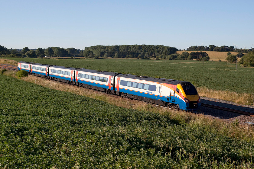 222014, EM 18.12 Nottingham-London St. Pancras (1B72, 2L), Harrowden Junction 
 As the shadows lengthen, 222014 forms the 18.12 Nottingham to London St. Pancras. This is going to be the last summer that it is going to be possible to take uninterrupted pictures at this classic location. The drive to electrification means that soon the stanchions and wires will be in place, ruining the open views. 
 Keywords: 222014 1B72 Harrowden Junction