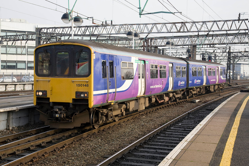 150148, NT 10.59 Chester-Manchester Piccadilly (2H31), Manchester Piccadilly station 
 150148 arrives at Manchester Piccadilly forming the 10.59 from Chester. I am not sure what route this service took, but I suspect that it went via Delamere, Knutsford and Stockport. 
 Keywords: 150148 10.59 Chester-Manchester Piccadilly 2H31 Manchester Piccadilly station