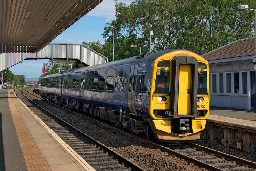 158729, SR 10.22 Cowdenbeath-Edinburgh Waverley (2G52, RT), Dalmeny station 
 Taken the wrong side of the light but with judicious use of Photoshop a reasonable image has been produced! 158729 comes to a halt at Dalmeny station forming the 10.22 Cowdenbeath to Edinburgh service. The station sits in an elevated position just south of the Forth River with the famous bridge seen in the background. 
 Keywords: 158729 10.22 Cowdenbeath-Edinburgh Waverley 2G52 Dalmeny station