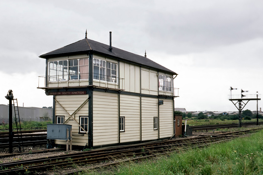 Wigston South Junction signal box (Mid, 1900) 
 The large Wigston South Junction signal box is seen from the rear located in the southern suburbs of Leicester. The Midland box was Type 3 structure constructed in 1900. It sat in the triangle of lines that linked the Midland Mainline to the Nuneaton route via Hinkley. Graham had in his notes that there was also a Wigston North Junction box that we attempted to find but we were thwarted by new industrial developments. 
 Keywords: Wigston South Junction signal box Midland Railway