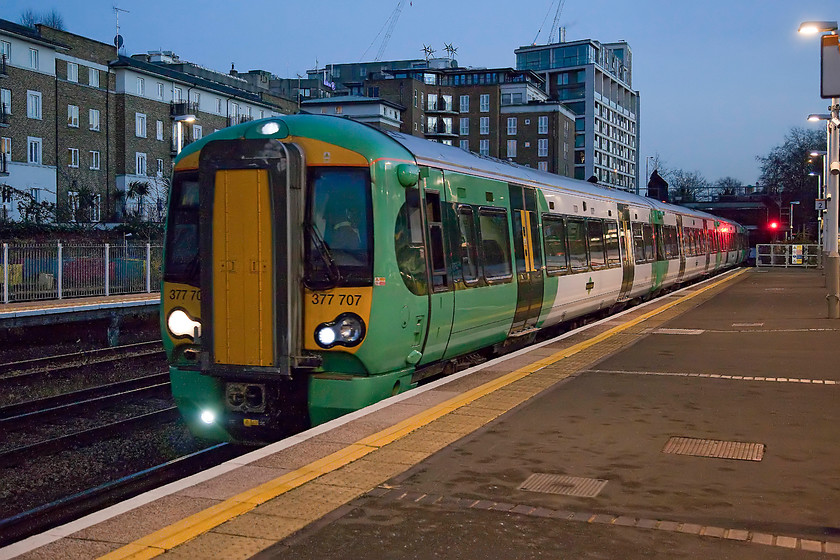 377707, SN 16.05 Clapham Junction-Watford Junction (2M47), Kensington Olympia station 
 Our first train home arrives at Kensington Olympia station. We took 377707, working the 16.05 Clapham Junction to Watford Junction to its destination. Normally these Southern services go as far as Milton Keynes that is convenient for us, but on Sundays they terminate at Watford Junction meaning that we have to complete our journey on a London Midland service. 
 Keywords: 377707 16.05 Clapham Junction-Watford Junction 2M47 Kensington Olympia station