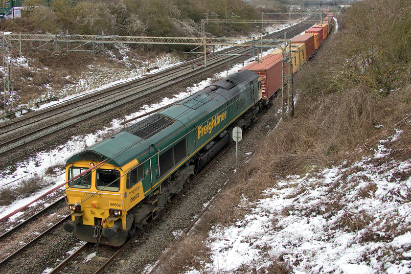 66502, 12.12 Lawley Street-London Gateway (4L46), Victoria bridge 
 66502 'Basford Hall Centenary 2001' leads the 12.12 Lawley Street to London Gateway Freightliner past Victoria bridge between Roade and Ashton on the southern WCML. Having been at Victoria bridge for about an hour now, I was beginning to get cold being exposed to the stiff north easterly wind. 
 Keywords: 66502 12.12 Lawley Street-London Gateway 4L46 Victoria bridge