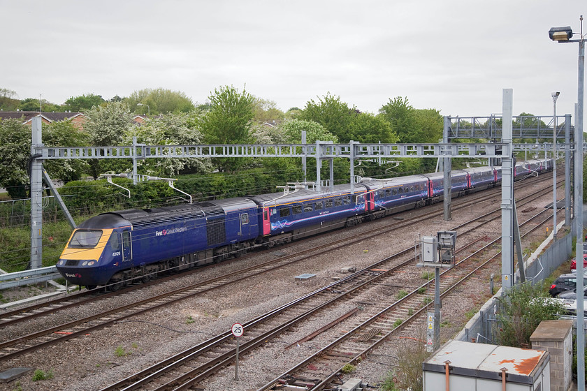 43129 & 43134, GW 12.00 London Paddington-Bristol Temple Meads (1C13, 4E), Didcot Parkway temporary car park footbridge 
 The 12.00 Paddington to Bristol Temple Meads leaves Didcot powered by 43129 at the rear and 43134 on the front. The picture is taken from a temporary footbridge installed by Network Rail to allow access to and from the newly constructed car park. It offers a lofty and convenient view of the running lines. 
 Keywords: 43129 43134 1C13 Didcot Parkway