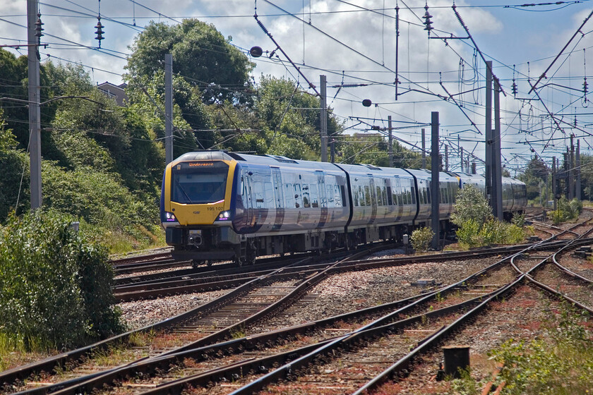 195107 & 195111, NT 11.29 Manchester Airport-Windemere (1C71, 3L), Carnforth station 
 Northern's 195107 and 195111 approach Carnforth at speed working the 1C71 11.29 Manchester Airport to Windemere service. This train will continue at a relatively high speed for a fairly winding and climbing eighteen miles or so until it diverges from the WCML at Oxenholme Lake District to then complete its journey on a severely speed-restricted single track. 
 Keywords: 195107 195111 11.29 Manchester Airport-Windemere 1C71 Carnforth station Northern