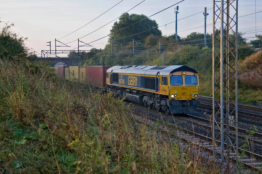 66740, 02.15 Felixstowe South-Hams Hall (4M01), Roade Hill 
 Named just three weeks ago at Norwich station, 66740 'Sarah' passes Roade Hill with Victoria bridge seen in the background. It is leading the 4M01 02.15 Felixstowe to Hams Hall Freightliner. The GBRf Class 66 is named after a member of the company's finance staff in line with their recently adopted inclusiveness policy and according to their Facebook page it appears to have gone down well, see..... https://www.facebook.com/GBRailfreight/posts/66740-is-the-latest-of-our-locos-to-be-named-after-one-of-our-office-girls-in-a-/681188878630722/ 
 Keywords: 66740 02.15 Felixstowe South-Hams Hall 4M01 Roade Hill Sarah