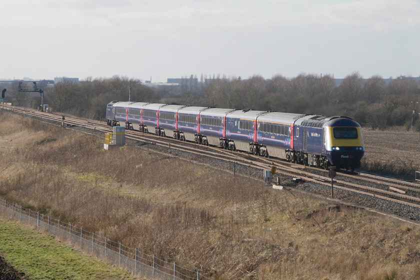 Class 43, 13.55 Cardiff Central-London Paddington (1L65), Bourton SU228874 
 At seventy-two miles from Paddington are the Bourton crossovers that the HST forming the 13.55 Cardiff to London service is seen passing over. This classic location is about four miles east of Swindon and provides superb open views of the line, that is until the forthcoming electrification arrives to spoil everything. The buildings behind the trees are Swindon's Honda plant at South Marston. 
 Keywords: Class 43 HST 13.55 Cardiff Central-London Paddington 1L65 Bourton SU228874