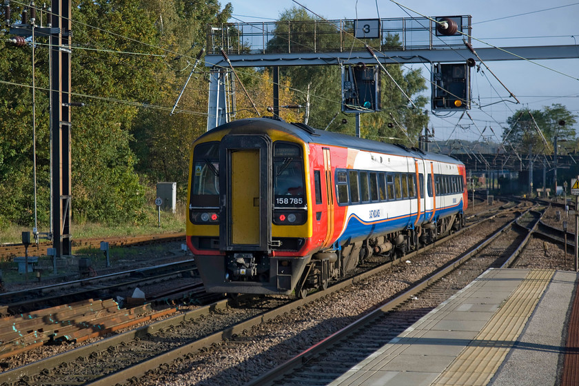 158785, EM 13.57 Norwich-Liverpool Lime Street (1R94), Norwich station 
 In superb lighting at Norwich, East Midlands Trains' Sprinter 158785 gets away bang on time with the 1R94 13.57 service to Liverpool Lime Street. I like the livery that EMT apply to their trains and think that it looks good in all lighting due in a large part to the huge swathe of white along the flanks. 
 Keywords: 158785 13.57 Norwich-Liverpool Lime Street 1R94 Norwich station EMT East Midlands Trains Sprinter