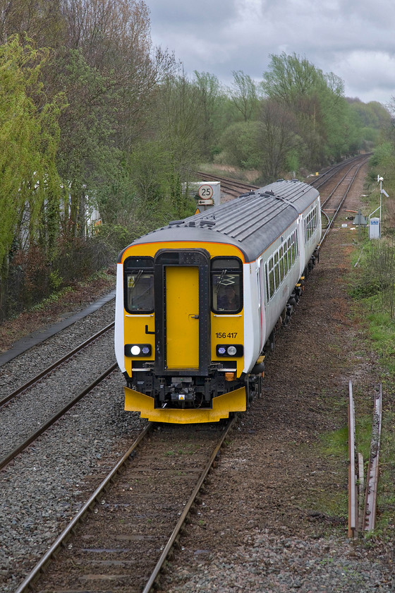 156417, LE 11.48 Lowestoft-Norwich (2J75), Whitlingham Lane crossing TG266083 
 Again, looking very smart, 156417 approaches the eastern side of Norwich with the 11.48 from Lowestoft that will terminate at the city's Thorpe station in a few minutes time. The train has just crossed Whitlingham Junction with the double-track (as far as Hoverton and Wroxham) curving off to the left. 
 Keywords: 156417 11.48 Lowestoft-Norwich 2J75 Whitlingham Lane crossing TG266083 Abellio Greater Anglia