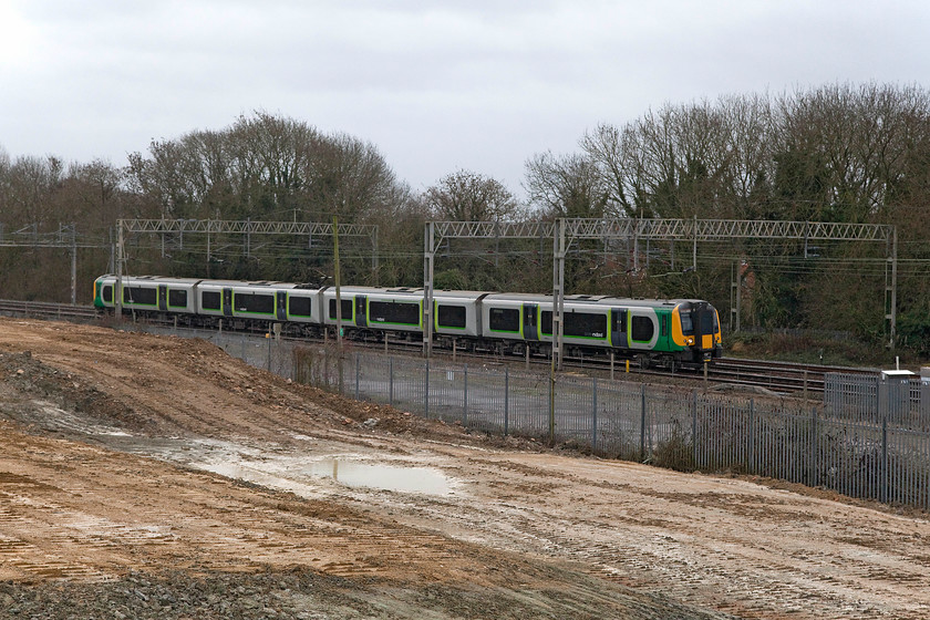 350229, LM 11.54 London Euston-Northampton (2N47), Site of Roade station 
 350229 forms the 11.54 Euston to Northampton 2N47 past the site of Roade station with the flattened remains of the Pianoforte factory in the foreground. A short ride home from here on my bike to make some mince pies and then to put my feet up in front of the fire! 
 Keywords: 350229 11.54 London Euston-Northampton 2N47 Site of Roade station