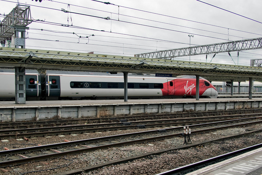 390020, VT 13.15 Manchester Piccadilly-London Euston (1A33, 2L), Manchester Piccadilly station 
 390120 stands at Manchester Piccadilly station ready to work the 13.15 to London Euston. My wife and I took this train back home to Milton Keynes. Things did not quite to plan due to issues with the OLE north of Colwich. At Stone, we were diverted across to Norton Junction to then head south to Stafford. From there we headed south-east back to our planned route at Colwich Junction. This re-route added a few minutes to arrival time at Milton Keynes as there did appear to be plenty of recovery time within the timings. This could be my last Virgin Pendolino journey before the new operator takes over at the start of December? 
 Keywords: 390020 13.15 Manchester Piccadilly-London Euston 1A33 Manchester Piccadilly station