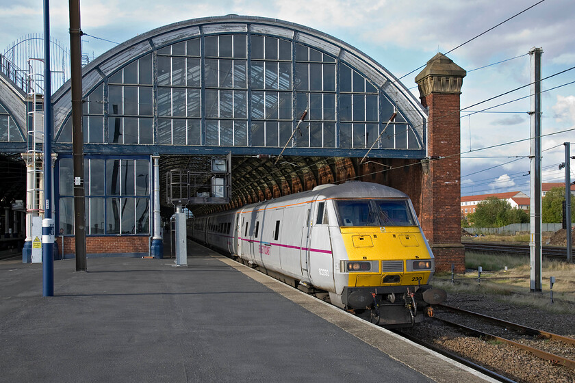 82230, GR 17.25 Newcastle-London King's Cross (1Y47), Darlington station 
 82230 emerges from Darlington station into the lovely evening sunshine getting the 17.25 Newcastle to Kings Cross south away from the station. I took a very similar photograph back in May 1978 when on my Eastern Region railrover but the motive power was a little different then, see. https://www.ontheupfast.com/p/21936chg/25366364404/x55010-13-10-edinburgh-london-kings 
 Keywords: 82230 17.25 Newcastle-London King's Cross 1Y47 Darlington station East Coast DVT