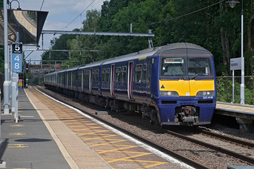 321406 & 321307, GA 14.05 Clacton-on-Sea-London Liverpool Street (1N41, 2E), Ingatestone station 
 It's good to see an old friend! 321406 was a unit that I have many photographs of close to my home area when it was in use with Silverlink back in the early 2000s. Prior to that, the 321/4 sub class were operated under the North London Railways franchise that was later to become Silverlink. From new up until Eversholt Rail acquired the units they were operated by Network SouthEast replacing the Class 317s that had a very short-lived use between London and Northampton and Birmingham themselves replacing the venerable slam-door Class 310s. With 321397 at the rear, the pair of units work the 1N41 14.05 Clacton to Liverpool Street service as it approaches its stop at Ingatestone station. 
 Keywords: 321406 321307 14.05 Clacton-on-Sea-London Liverpool Street 1N41 Ingatestone station Great Anglia Dusty Bin