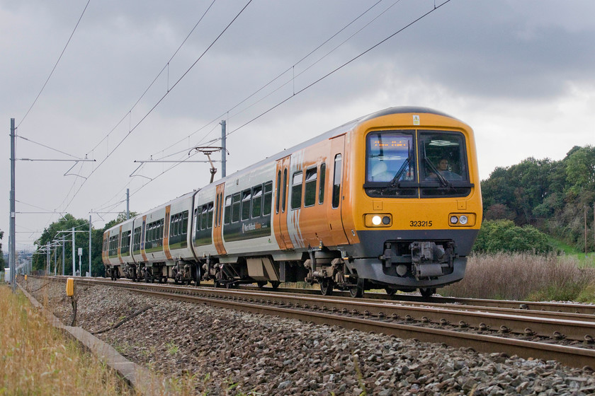 323215, LN 14.12 Bromsgrove-Four Oaks (2U52, 1L), Vigo SO986712 
 Having descended Lickey a short time earlier, 323215 ascends with the 14.12 Bromsgrove to Four Oaks. This train made a standing start at the immediate foot of the climb but testament to the efficiency of electric power, it had reached line speed by this stage. The class 323s have done good work in the West Midlands for many years but their time is now limited due to new stock being introduced. 
 Keywords: 323215 14.12 Bromsgrove-Four Oaks 2U52 Vigo SO986712