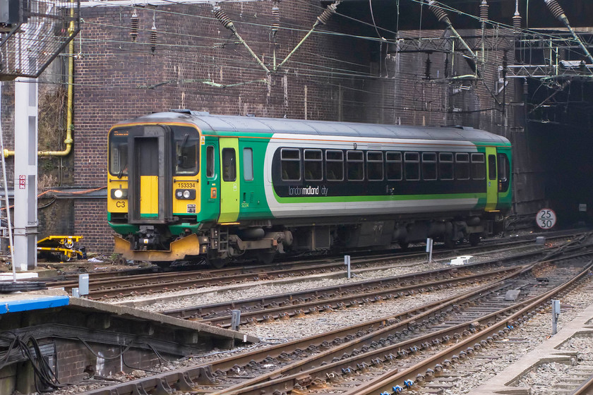 153334, LM 12.00 Tyseley LMD-Coventry ECS (5G45), Birmingham New Street station 
 London Midland has eight single car class 153 units for use on their network. Built in 1990, 153334 arrives into New Street station as the 5G45 12.00 Tyseley to Coventry ECS working. After arrival at New Street, the 'Super Sprinter' will then retrace its steps as far as Curzon Street Junction where it will then continue towards Coventry ready to take up its duties between there and Nuneaton. 
 Keywords: 153334 12.00 Tyseley LMD-Coventry ECS 5G45 Birmingham New Street station