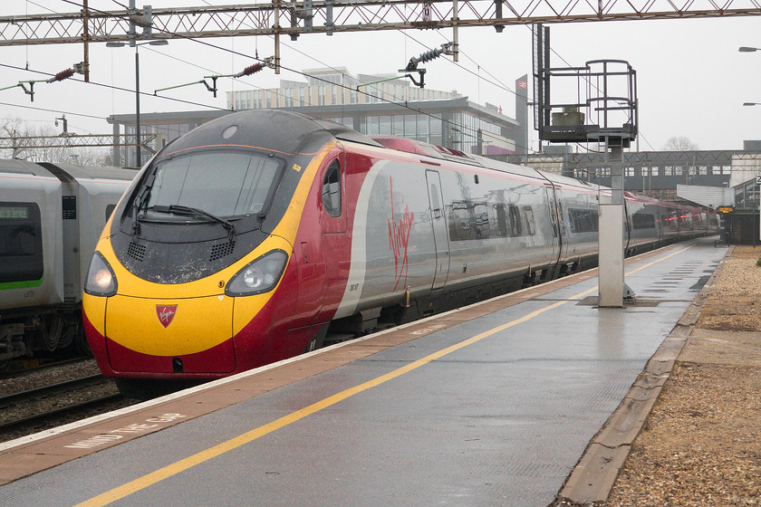 390107, VT 08.45 London Euston-Glasgow Central (1S37), Northampton station 
 As is fairly common practice on a Sunday, the Weedon loop line is closed until early/mid-morning meaning that all services come through Northampton. Here, 390107 comes sedately through the station forming the 1S37 08.45 Euston to Glasgow Central. 
 Keywords: 390107 08.45 London Euston-Glasgow Central 1S37 Northampton station