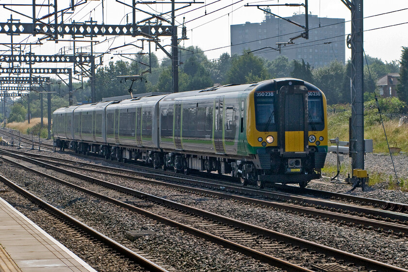 350238, LM 10.16 Northampton-Birmingham New Street (cancelled from Euston) (1Y15), Rugby station 
 Something had gone wrong earlier in the morning as this service should have originated from Euston. 350238 arrives at Rugby as the re-timetabled 10.16 Northampton to Birmingham London Midland train. 
 Keywords: 350238 10.16 Northampton-Birmingham New Street cancelled from Euston 1Y15 Rugby station