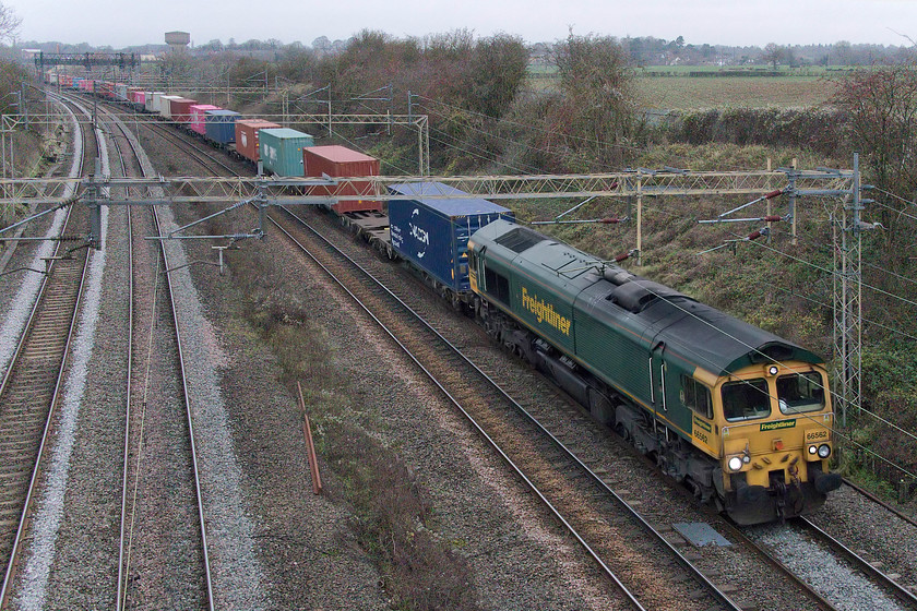 66562, 12.16 Lawley Street-London Gateway (4L46, 2L), Victoria bridge 
 It's 14.30 in the afternoon and the light has dropped to such a poor level that Andy and I decided this would be the second to last train that we would see before moving off for a coffee at a local country park. 66562 leads the 12.16 Lawley Street to London Gateway Freightliner past Victoria bridge. I photographed this locomotive working the same service but in much better weather back on the second day of the COVID-19 lockdown back in March, see..... https://www.ontheupfast.com/p/21936chg/28936891804/x66562-12-16-lawley-street-london 
 Keywords: 66562 12.16 Lawley Street-London Gateway 4L46 Victoria bridge Freightliner