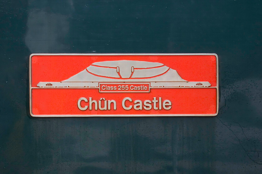 Nameplate, 43153 GW 14.00 Cardiff Central-Penzance (2C70, 30L), Weston-super-Mare station 
 The Class 255 Castle HST power cars carry proper nameplates on their flanks. The names all relate to castles throughout the area where they operate; a nice touch! The plates are quite ornate and very nicely produced in the best spirits of the GWR as seen here at Weston-super-Mare where 43153 'Chn Castle' has paused working the delayed 14.00 Cardiff to Penzance service. Chn Castle is a large Iron Age hillfort near Penzance built two and half thousand years ago; I doubt that the evergreen HST sets will quite match that age but they are doing pretty well approaching fifty! 
 Keywords: Nameplate 43153 14.00 Cardiff Central-Penzance 2C70 Weston-super-Mare station GRW Castle Class 255 HST Chn Castle