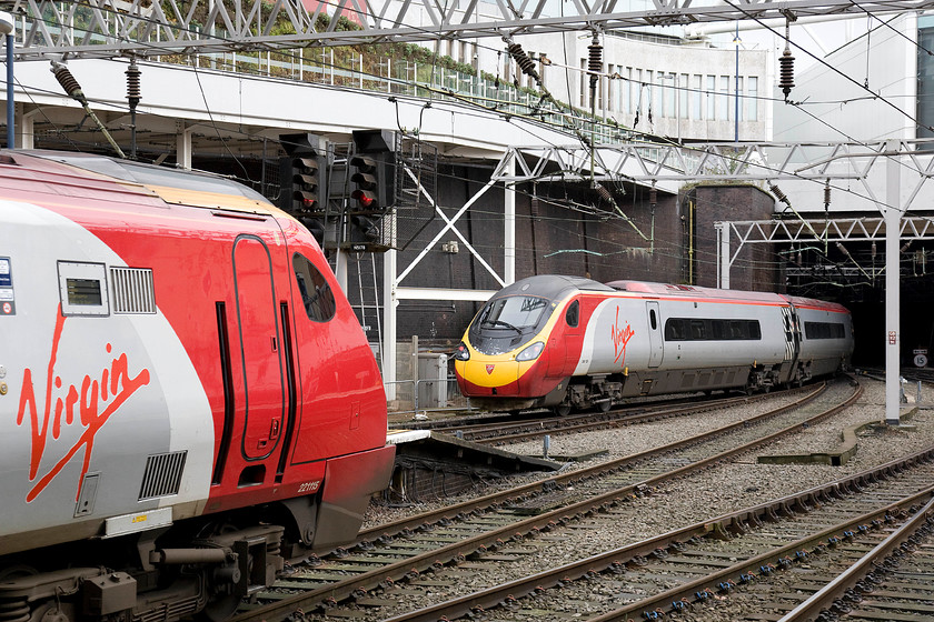 221115, VT 13.20 Birmingham New Street-Preston (2S65) & 390128, VT 12.47 Wolerhampton-London Euston (1B26), Birmingham New Street station 
 Virgin action at Birmingham New Street! 221115 'Polmadie Depot' waits to leave with the 2S65 13.20 to Preston. Meanwhile, 390128 'City of Preston' leaves with the 1B26 12.47 Wolverhampton to London Euston. 
 Keywords: 221115 13.20 Birmingham New Street-Preston 2S65 390128 12.47 Wolerhampton-London Euston 1B26 Birmingham New Street station