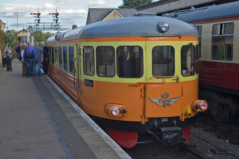 1212, 16.10 Wansford-Yarwell Junction, Wansford station 
 Former Sweedish Railways railcar 1212 'Helga' waits at Wansford station to work the 16.10 service to Yarwell Junction. I had waited all day at the Nene Valley Railway's diesel gala in order to travel on this service to enjoy travelling on this one-off train. The railcar looks superb after its full rebuild that was completed last year (2012) with it winning the coveted 'Railcar of the Year' award. 
 Keywords: 1212 16.10 Wansford-Yarwell Junction Wansford station Helga