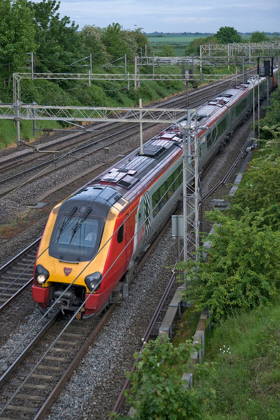 Class 221, VT 18.03 London Euston-Birmingham New Street (1G37), Victoria bridge 
 A Class 221 speeds northwards passing Victoria bridge near Roade working the 18.03 Euston to Birmingham New Street Virgin service. Yet another example of a diesel working a relatively short distance service entirely under fully energised wires.....can somebody explain how this is correct, please? 
 Keywords: Class 221 18.03 London Euston-Birmingham New Street 1G37 Victoria bridge Virgin Trains West Coast Voyager