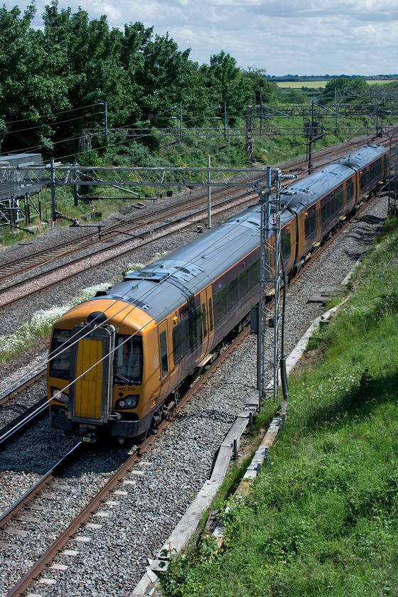 172332, 13.16 Ilford EMUD-Tyseley LMD (5Q66, 80E), Victoria bridge 
 It's come to a poor situation that a unit has to travel from its base in the West Midlands to have its wheels turned on a lathe in Essex! This is exactly what West Midlands Trains' 172332 has just had done returning as the 5Q66 13.16 Ilford to Tyseley. It is seen on the down fast line just south of Roade in Northamptonshire. I stand to be corrected but I believe that Ilford depot has one of the only suitable wheel lathes in the country meaning that it has a steady flow of work involving a lot of comings and goings. Could you imagine that in BR days? 
 Keywords: 172332 13.16 Ilford EMUD-Tyseley LMD 5Q66 Victoria bridge West Midlands Trains West Midlands Railway